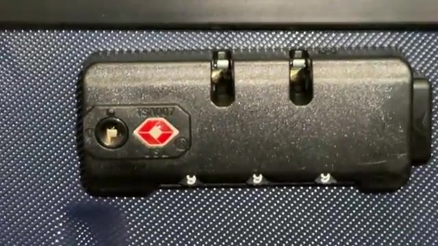 Suitcase combination lock with TSA symbol